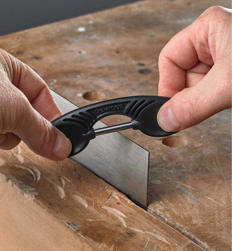 Veritas Card Scraper Burnisher being used to add rolled edge to cabinet scraper.