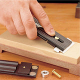 Veritas Small Blade Holder being used to sharpen a small blade.