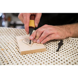 Woodcarver Carving a leaf