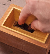 Veritas Miniature Cabinetmaker's Trimming Plane being used to plane tight inside a wooden box.